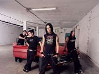 Bullet For My Valentine  The band posed with a car.